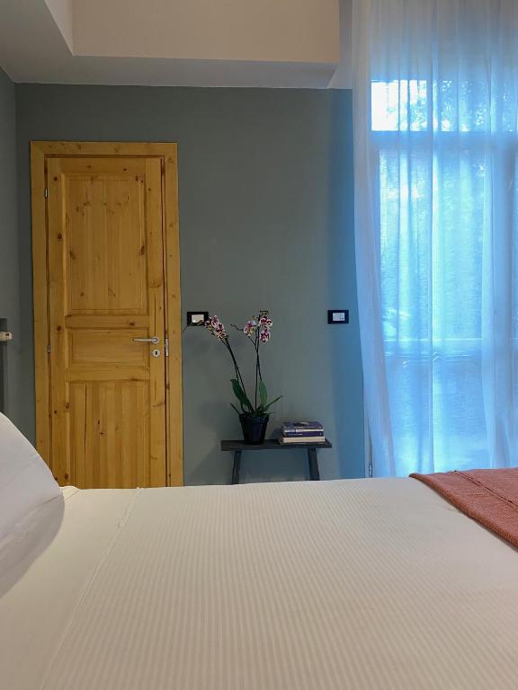 Posteľ alebo postele v izbe v ubytovaní Casimiro Rooms