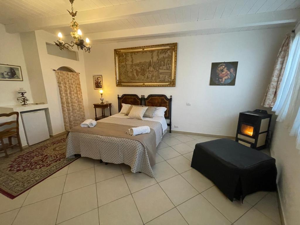 a bedroom with two beds and a stove in it at B&B Barletta Acasamia con Parcheggio Privato in Barletta