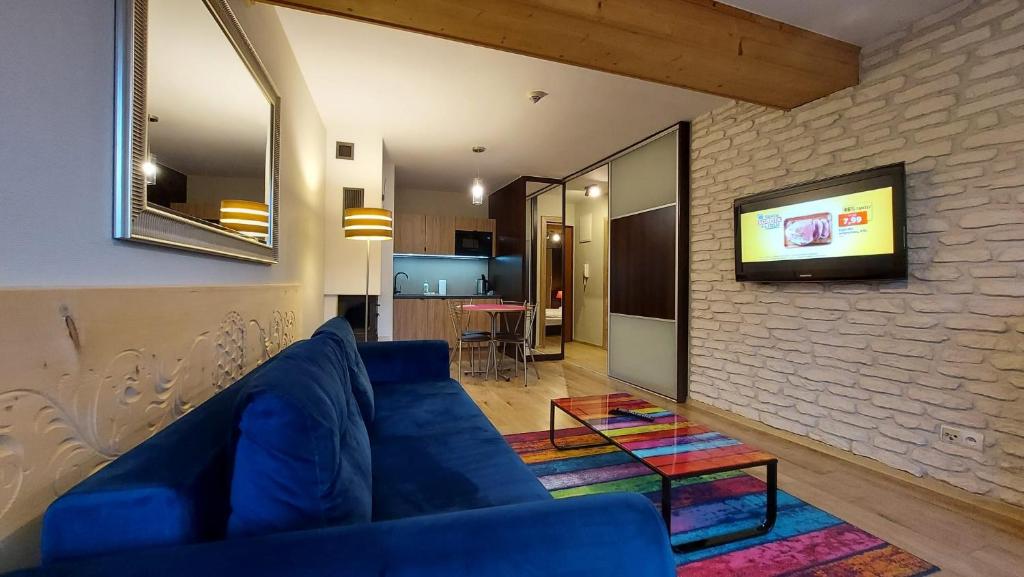 Televízia a/alebo spoločenská miestnosť v ubytovaní Apartament Widokowy 40