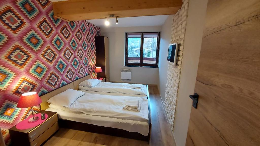 Posteľ alebo postele v izbe v ubytovaní Apartament Widokowy 40