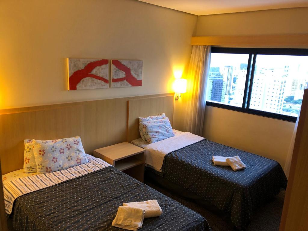 Cama o camas de una habitación en Apart-hotel Luxo