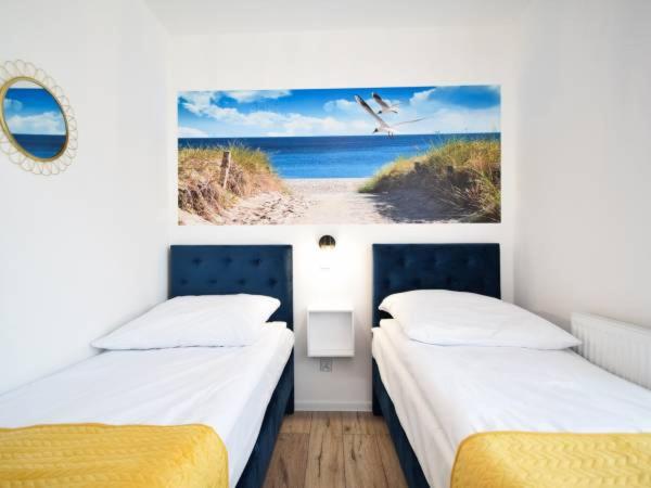 Posteľ alebo postele v izbe v ubytovaní Apartament Navy Blue