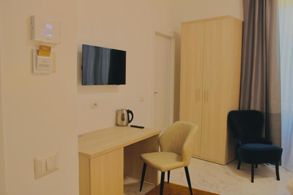 TV a/nebo společenská místnost v ubytování Hotel 900 Toscana