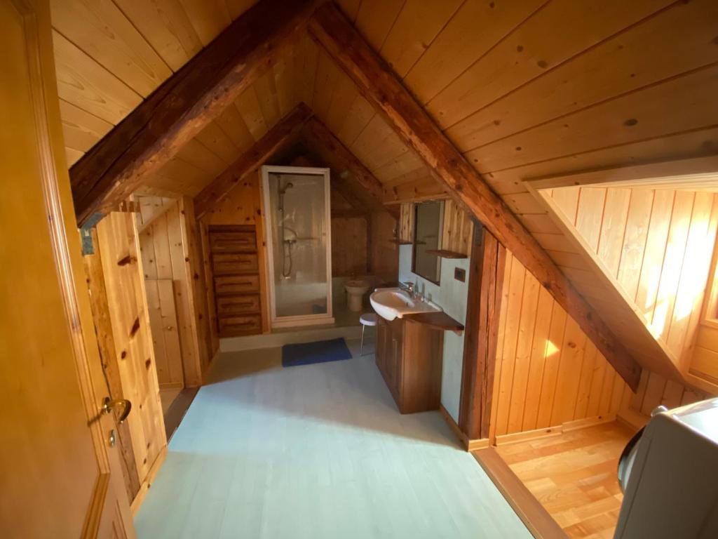 an overhead view of a bathroom in a wooden house at AGRITURISMO FARE BIO in Tarvisio