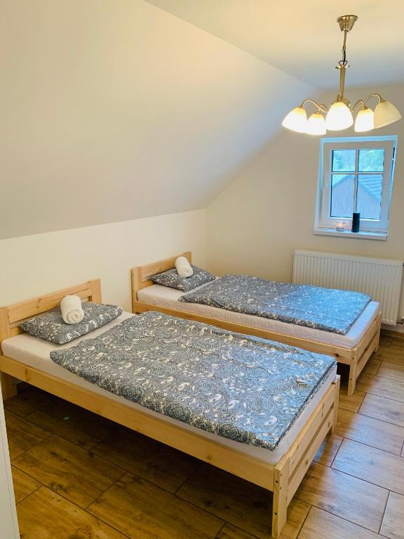 Postel nebo postele na pokoji v ubytování Apartmány Jetřichovice - České Švýcarsko