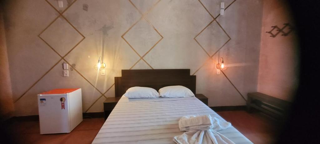 Una cama o camas en una habitación de Imbassaí Pousada Hostel Lujimba