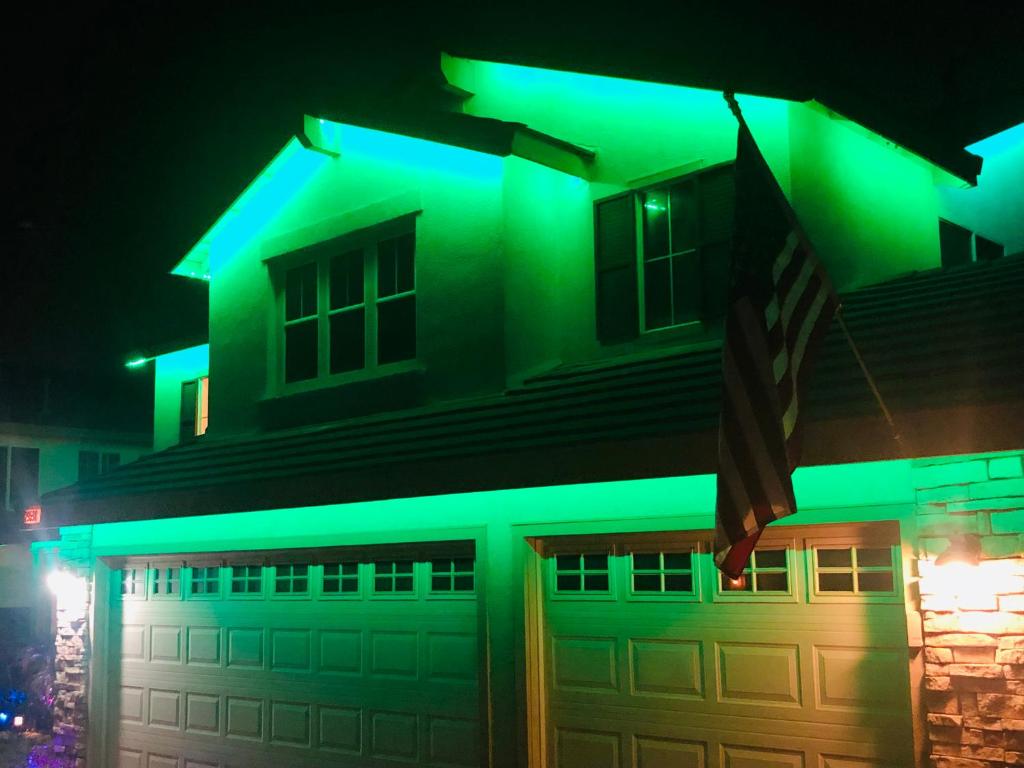 a house with green lights on it at night at Balloons and Wine in Murrieta