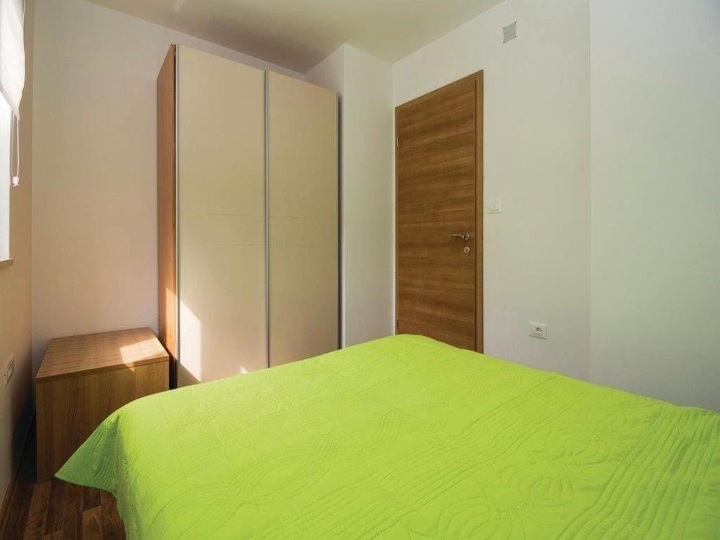 Postel nebo postele na pokoji v ubytování Apartments Grzic
