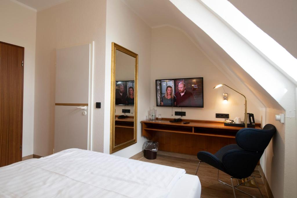 TV a/nebo společenská místnost v ubytování Landhotel Kauzenberg