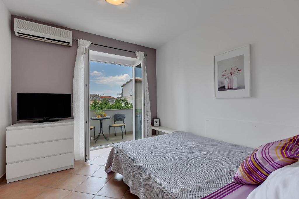 Posteľ alebo postele v izbe v ubytovaní Apartments Divna