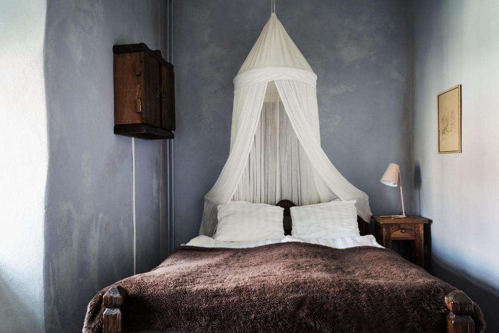 Postel nebo postele na pokoji v ubytování Hotel Helgeand Wisby