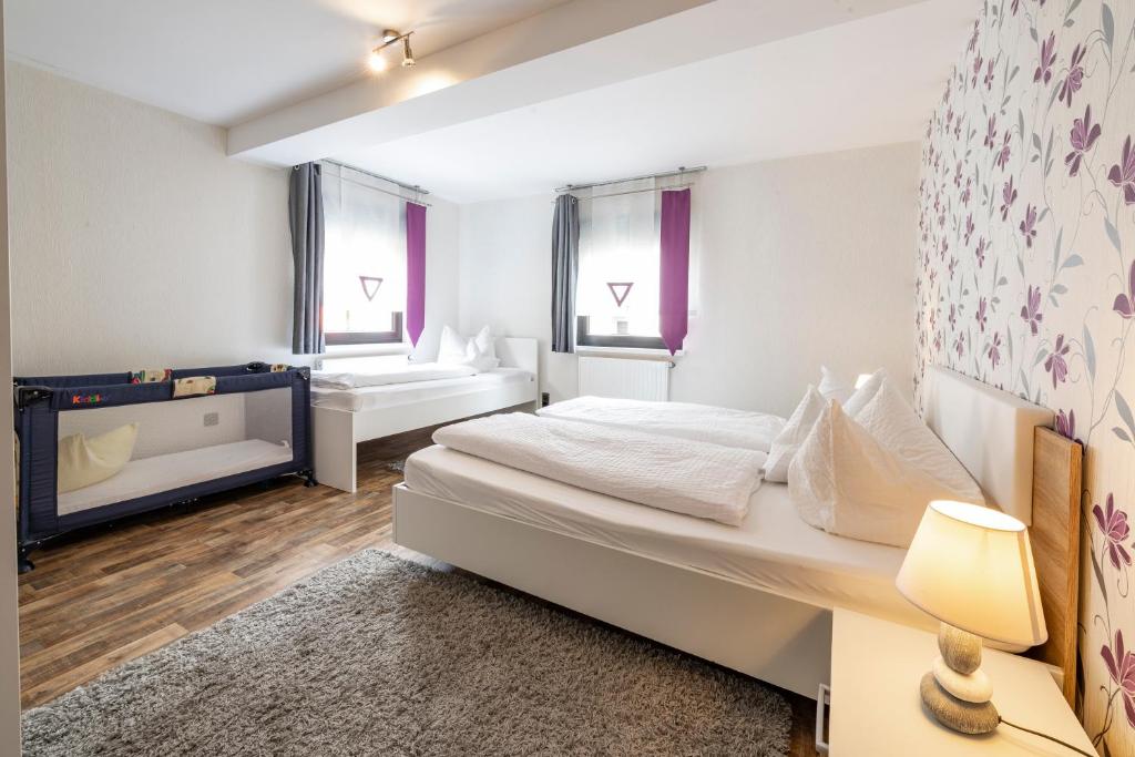 Postel nebo postele na pokoji v ubytování Zweck's Ferienwohnung