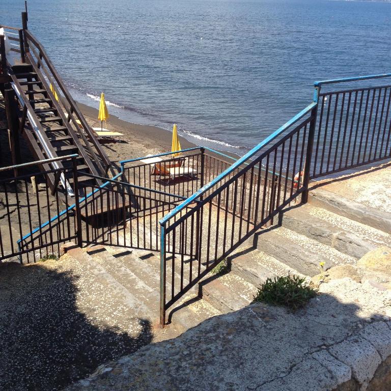 a set of stairs leading down to the beach at Azzurromare Residence in Procida