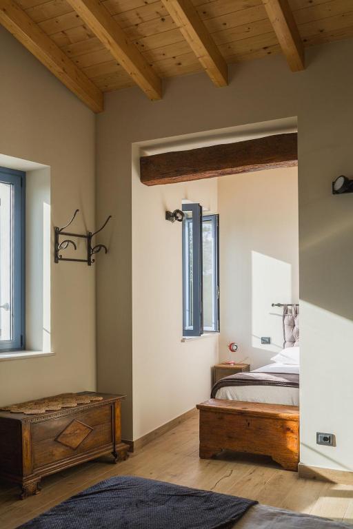 A bed or beds in a room at Corte Mira