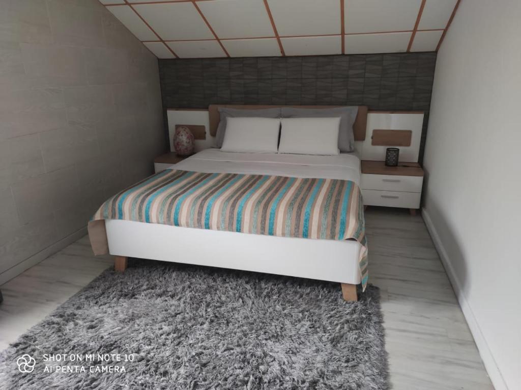 Postel nebo postele na pokoji v ubytování villa Areca