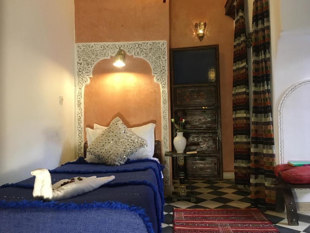 Postel nebo postele na pokoji v ubytování Riad Blue Berber