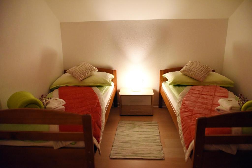 Postel nebo postele na pokoji v ubytování CIRIĆ APARTMANI