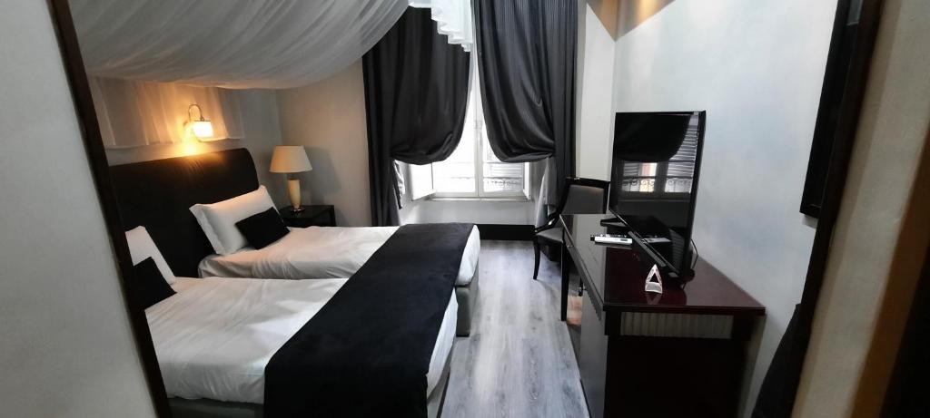 Postel nebo postele na pokoji v ubytování Hotel Giuggioli