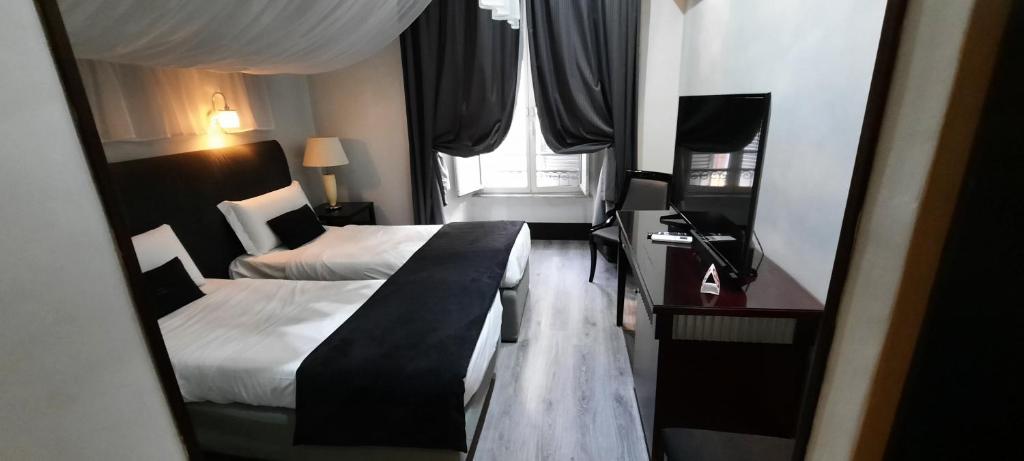 Postel nebo postele na pokoji v ubytování Hotel Giuggioli