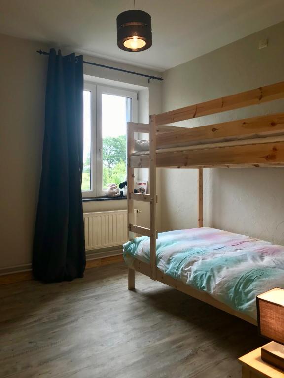Postel nebo postele na pokoji v ubytování Gîte aux prés de mon père
