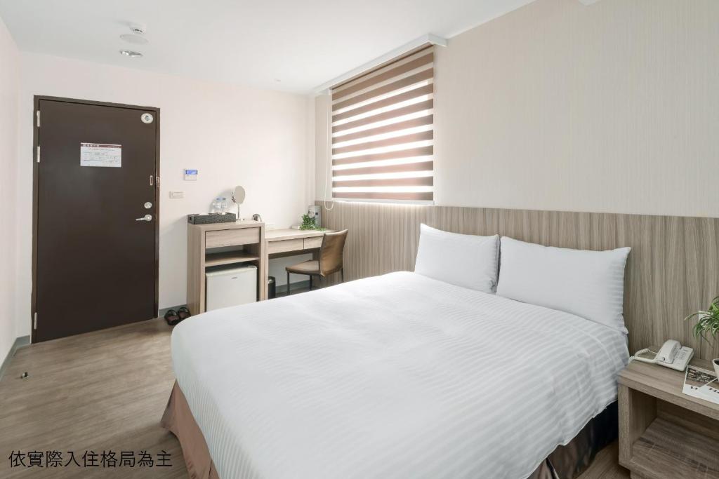 Кровать или кровати в номере Hotel Brown - Chihkan Branch