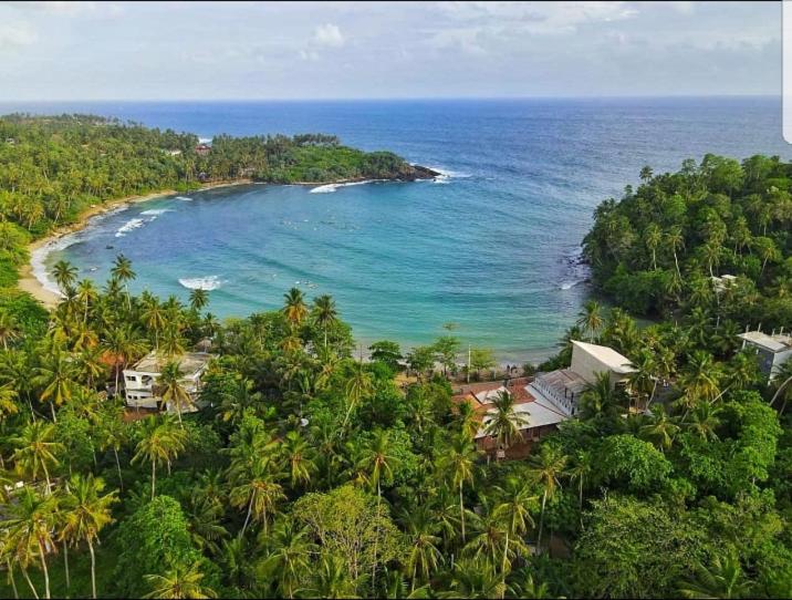 an aerial view of a beach in the ocean at Sea Port Hiriketiya in Hiriketiya