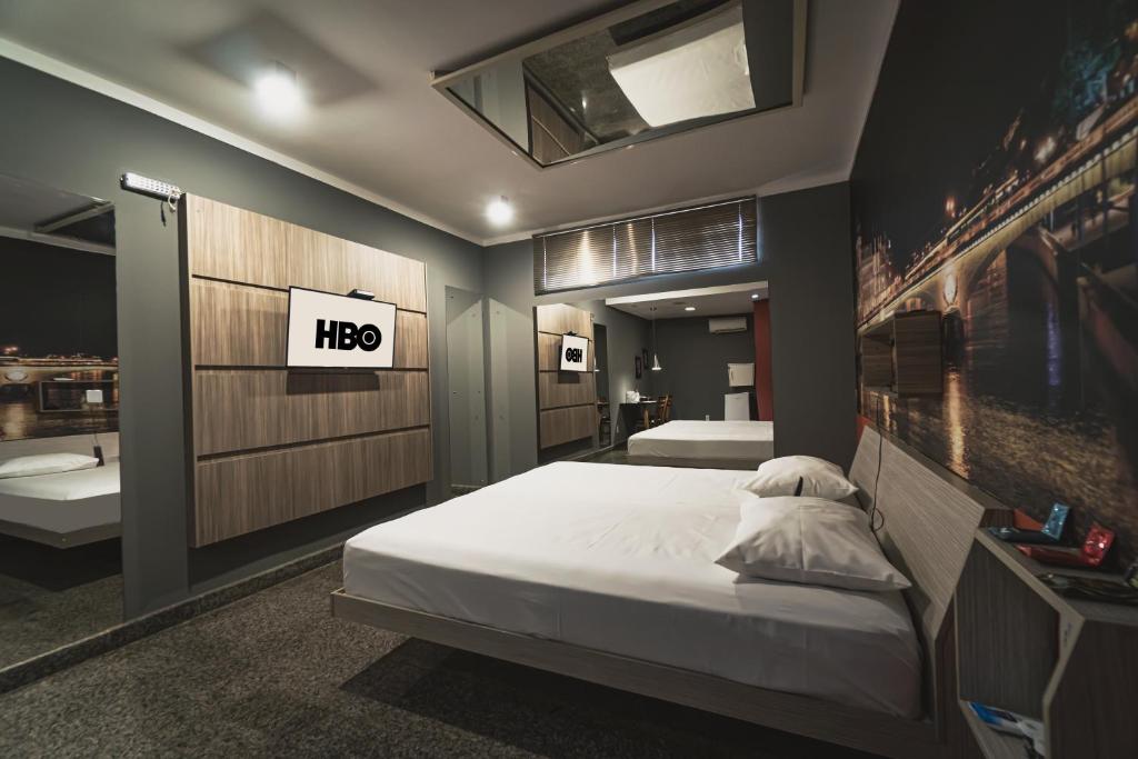 Postel nebo postele na pokoji v ubytování Paris Motel