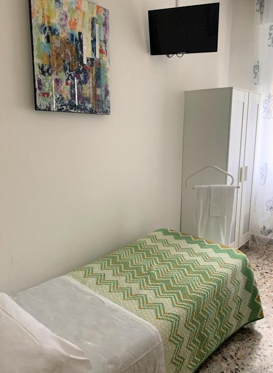 Postel nebo postele na pokoji v ubytování Albergo Moderno