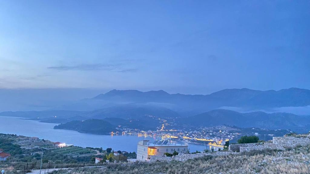 a view of a city and a body of water at Vila Llaka in Himare