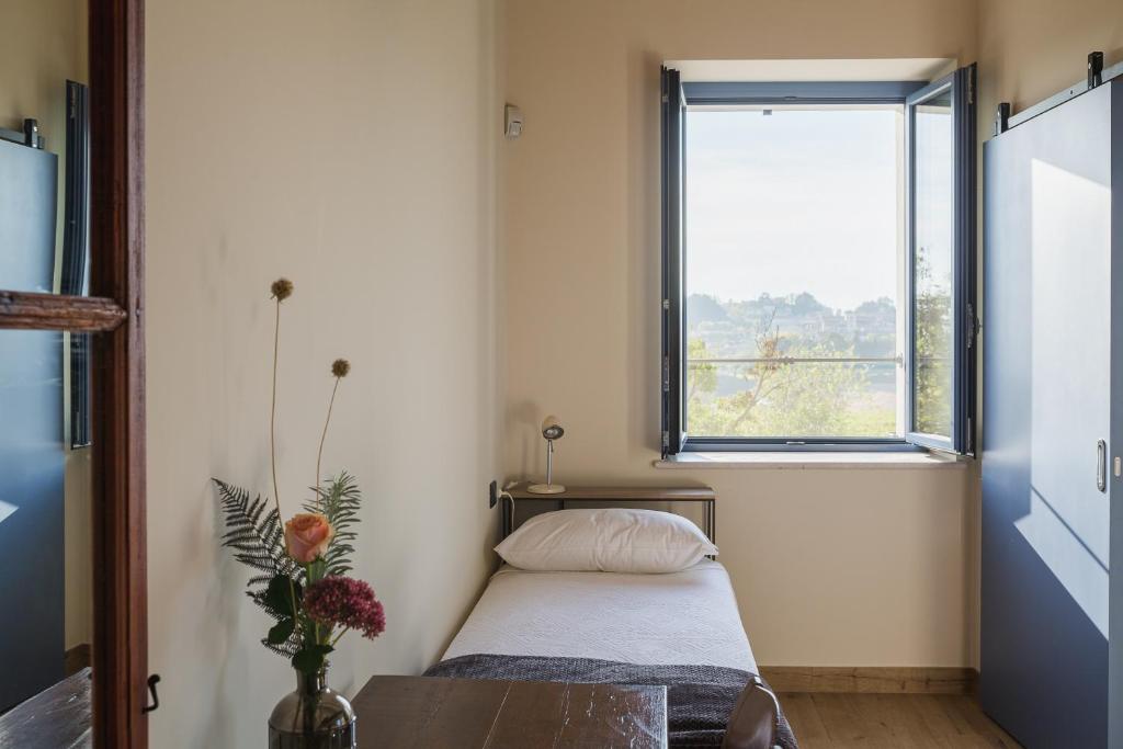 A bed or beds in a room at Corte Mira
