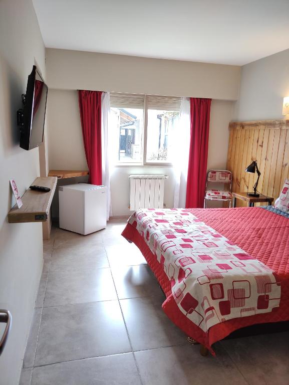 Postel nebo postele na pokoji v ubytování Hostal El Korú
