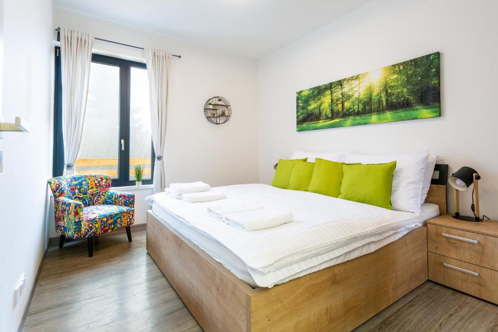Postel nebo postele na pokoji v ubytování SCANDIC Apartments Plešivec