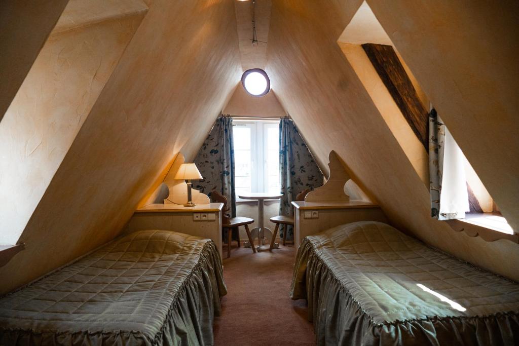 Postel nebo postele na pokoji v ubytování Hotel Saint-Martin