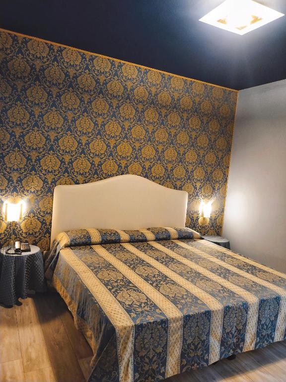 Postel nebo postele na pokoji v ubytování LAERTE PALACE HOTEL