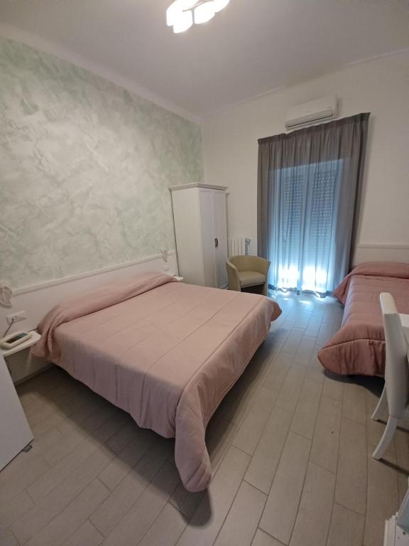 Postel nebo postele na pokoji v ubytování Hotel Costa