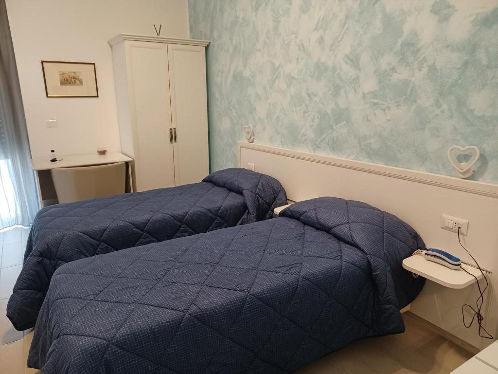 Postel nebo postele na pokoji v ubytování Hotel Costa