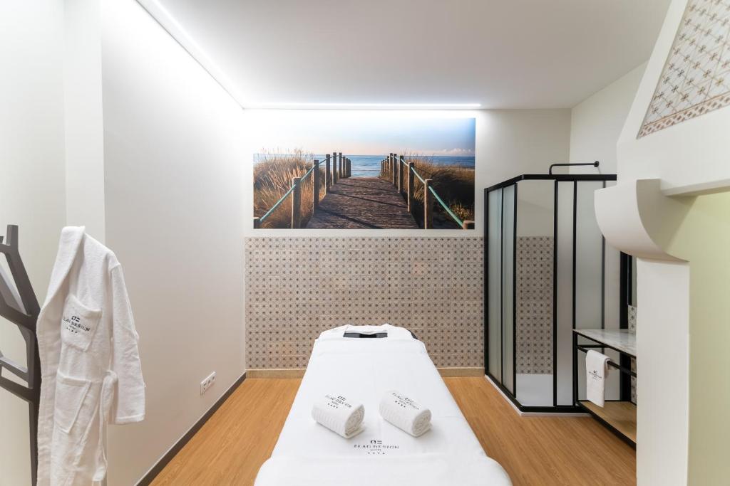 Postel nebo postele na pokoji v ubytování Flag Design Hotel