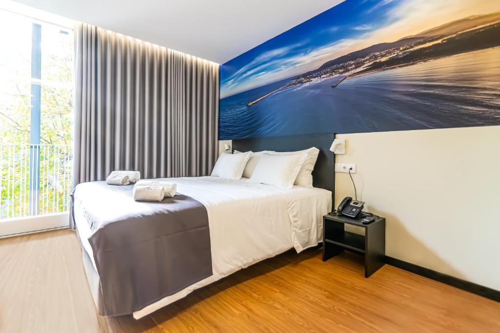 Postel nebo postele na pokoji v ubytování Flag Design Hotel