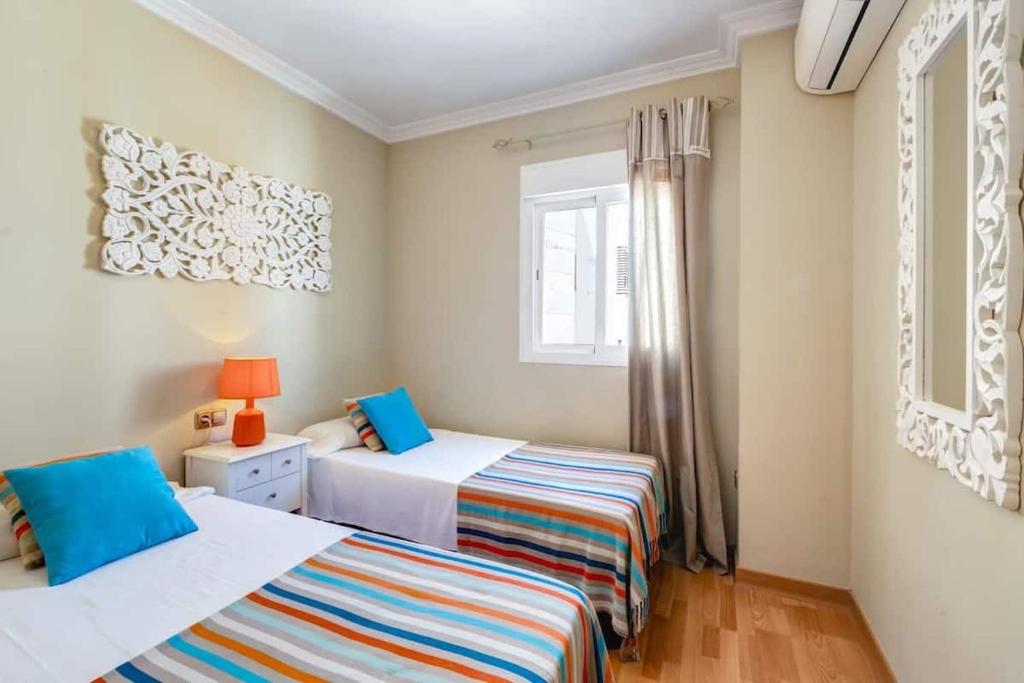 Posteľ alebo postele v izbe v ubytovaní Stunning Penthouse in the centre of Nerja
