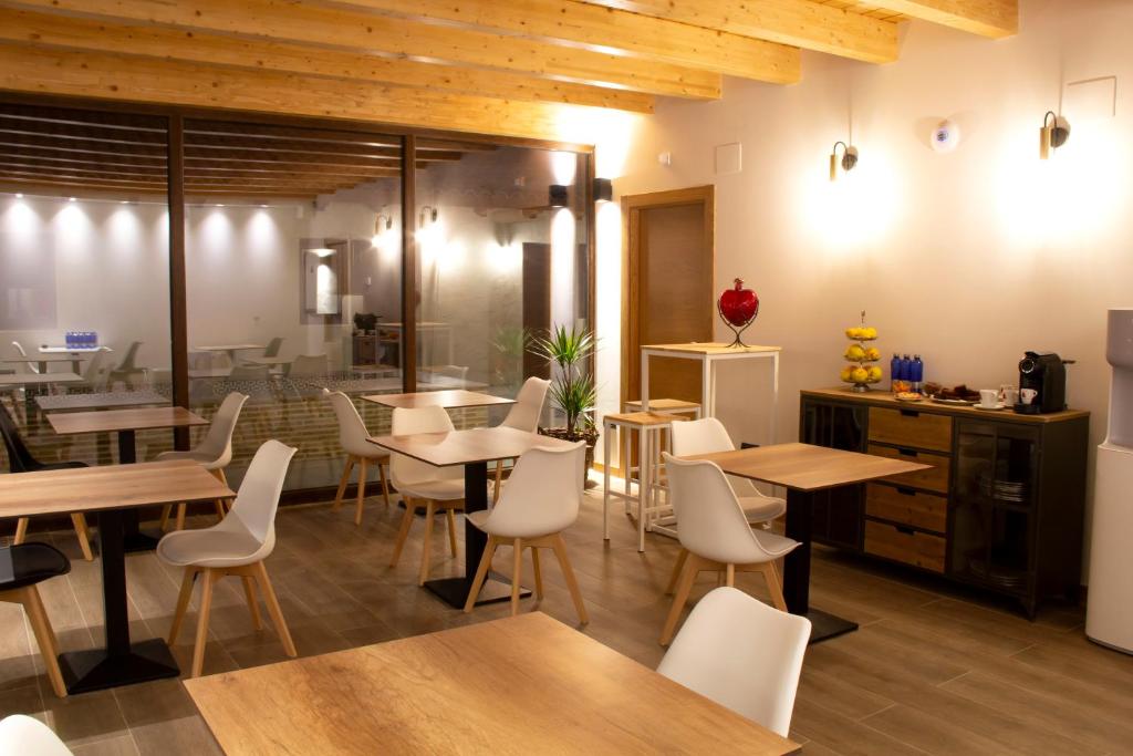 Reštaurácia alebo iné gastronomické zariadenie v ubytovaní Domus Oncinae