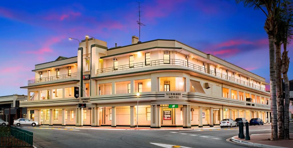 a large white building on the corner of a street at Hotel Renmark in Renmark