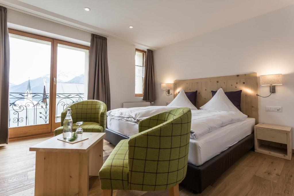 Postel nebo postele na pokoji v ubytování Meisser Hotel "superior"