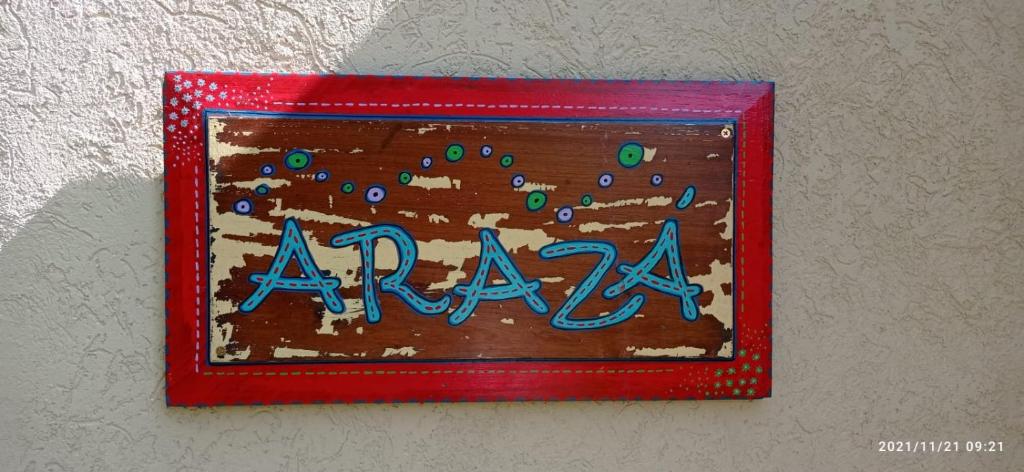 a cake with the word araina in a red frame at Arazá in Cuchilla Alta