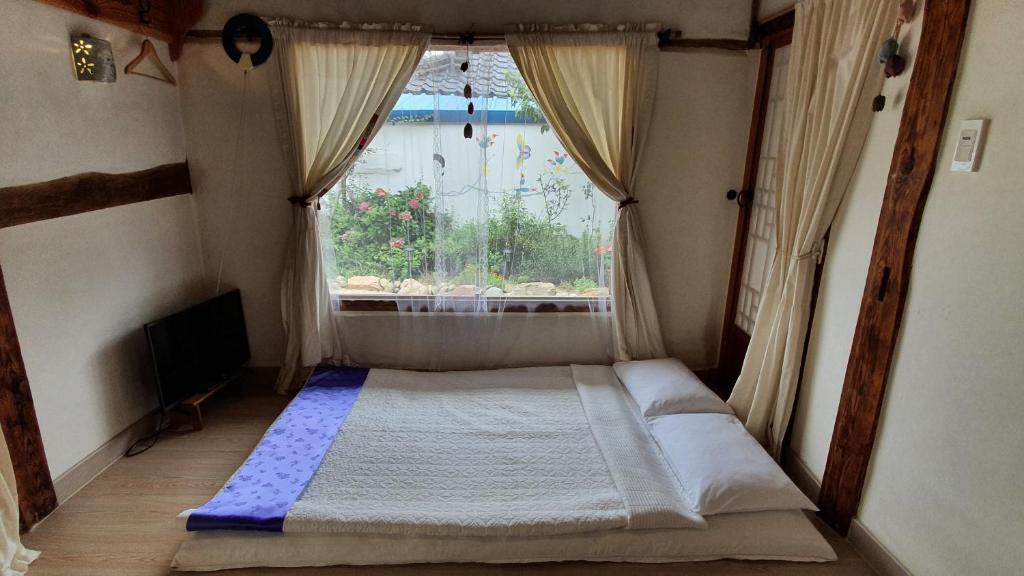 Postel nebo postele na pokoji v ubytování Greem Guesthouse