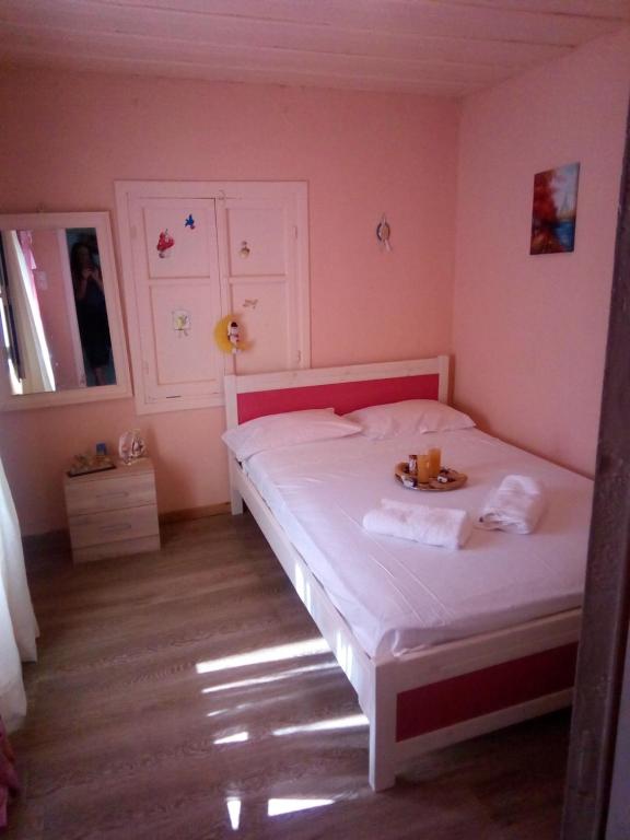 A bed or beds in a room at Villa Angela, Traditional Villa in the village