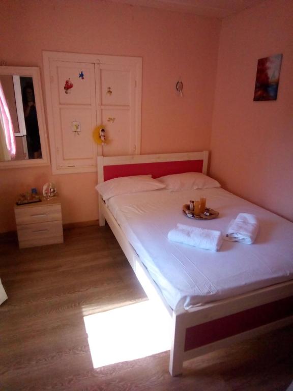 A bed or beds in a room at Villa Angela, Traditional Villa in the village