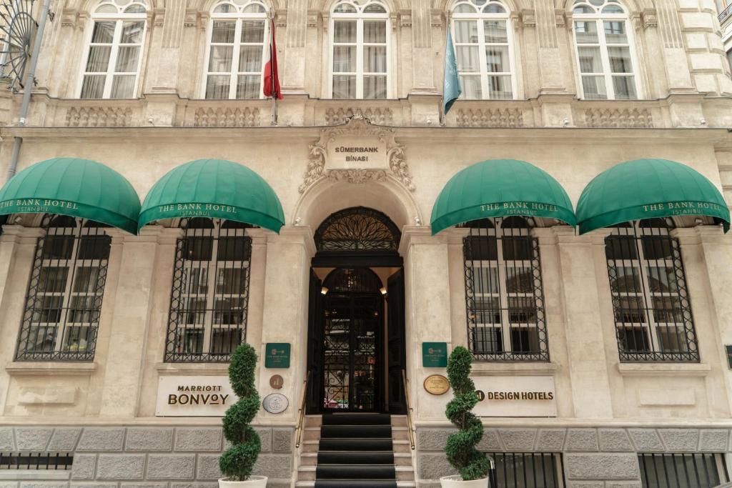 a building with two umbrellas in front of it at The Bank Hotel Istanbul, a Member of Design Hotels in Istanbul