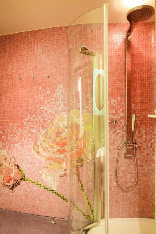 a shower with a picture of a dog on the wall at Les Fleurs Boutique Hotel in Sofia