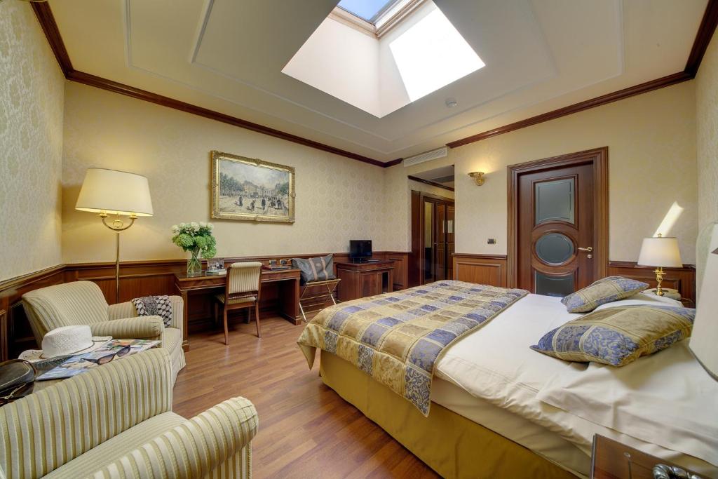 Postel nebo postele na pokoji v ubytování Hotel Splendid
