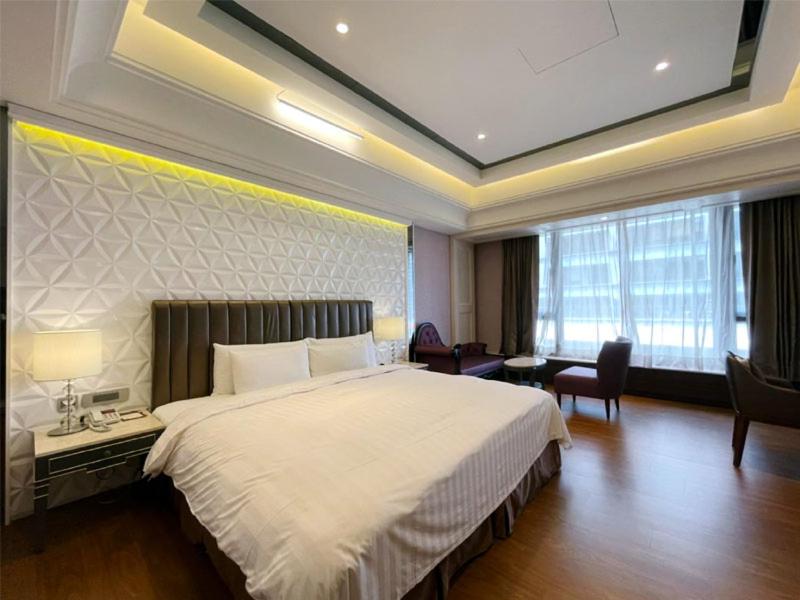 Postel nebo postele na pokoji v ubytování Chuang-tang Spring Spa Hotel